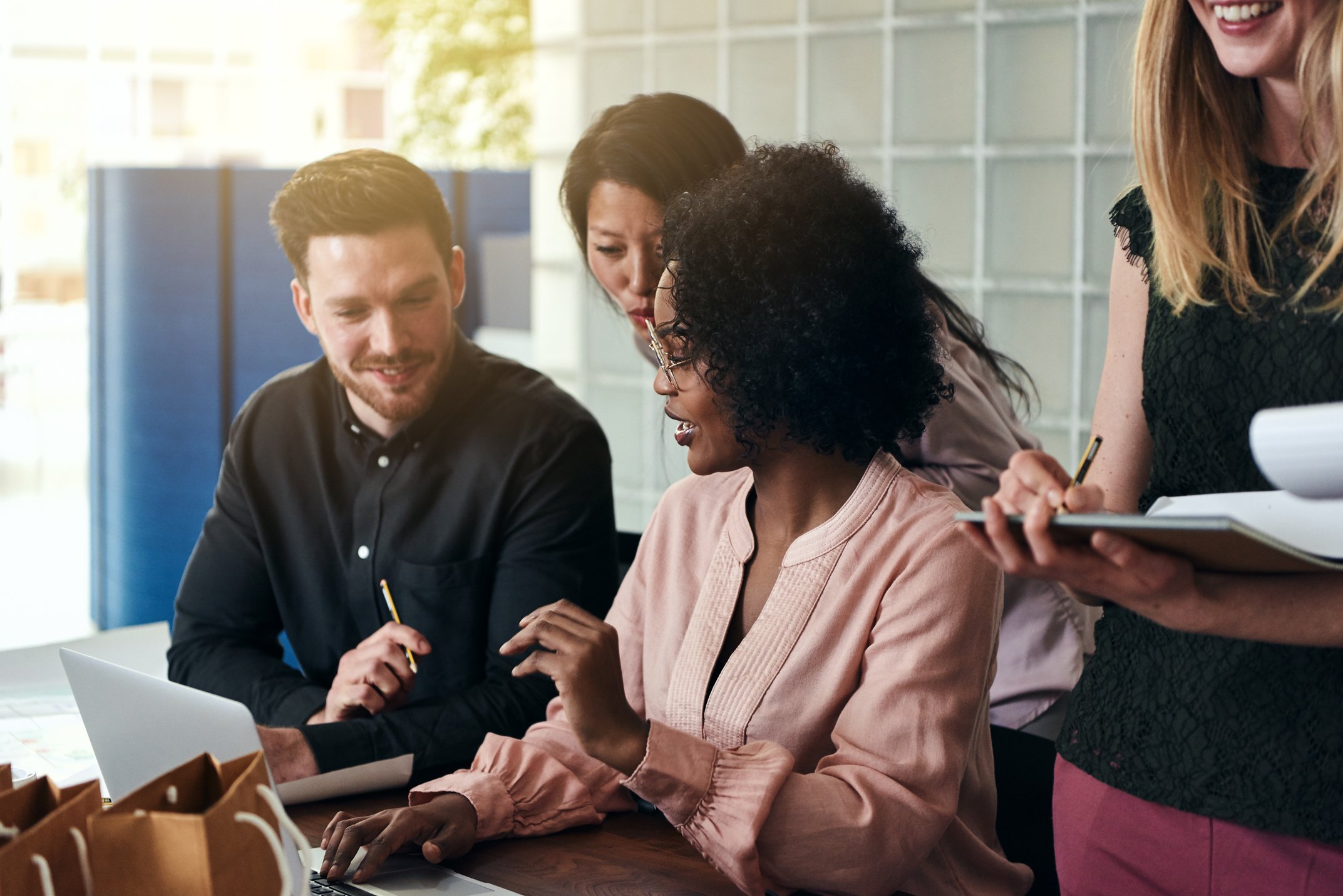 Diverse Group of Smiling Businesspeople Working Together